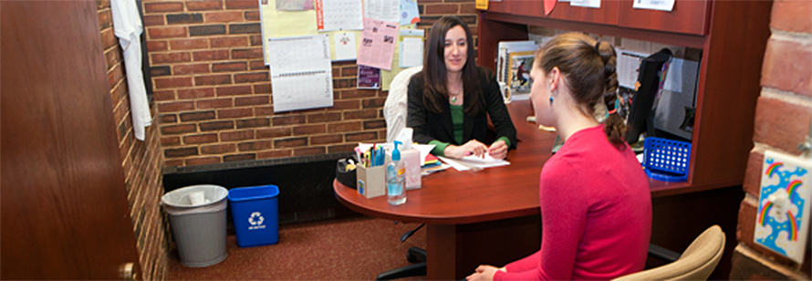 Student and staff member working together