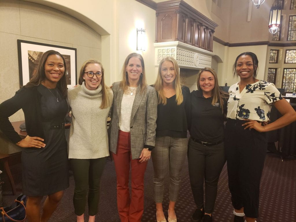 There are 6 people in this group photo, 3 Leadership Forum Panelists with 3 student-athletes.