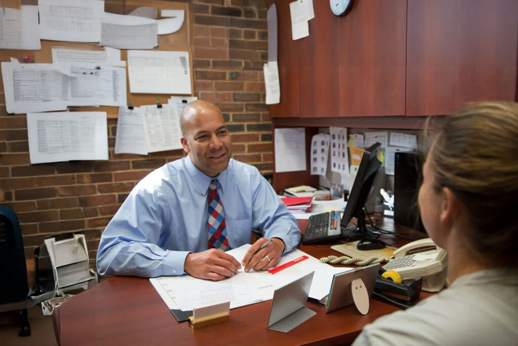 Student working with professional staff member